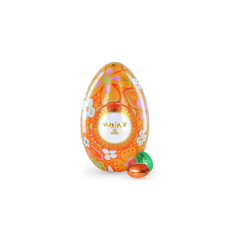 Oeuf de pâques orange en métal avec des chocolats dedans Maxim's